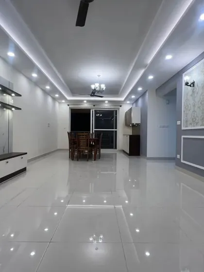 A wide shot of the unfurnished living and dining space, showing the excellent finish and the thoughtful layout design before the furniture is moved in.