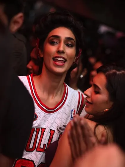 A classic Bulls jersey in the crowd. Hip-hop and basketball culture go hand in hand.