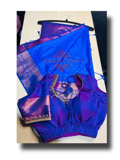A beautiful royal blue and purple silk saree set. The rental includes this custom blouse with a unique cutout back design and delicate gold embroidery, ensuring you stand out.