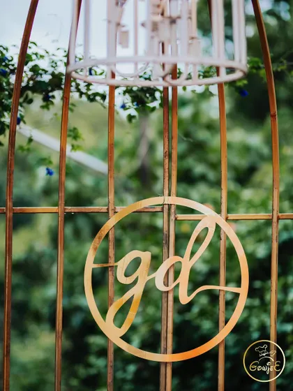 A custom laser-cut monogram of the couple's initials, a personal touch for their event decor.