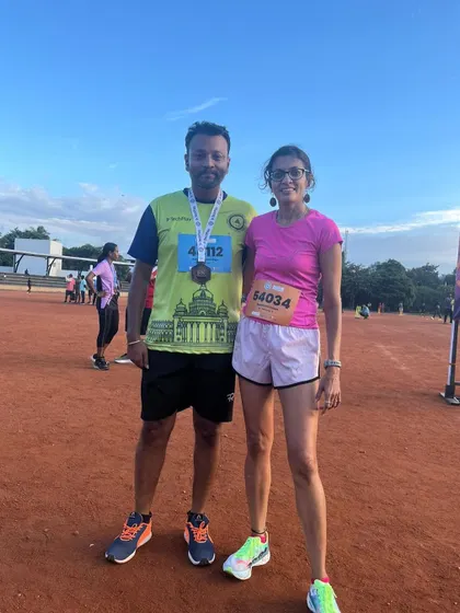 With a fellow runner at the Masters athletic event. The running community in Namma Bengaluru is incredibly supportive.