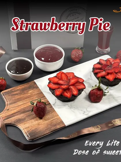 Our Strawberry Pie is a dose of sweetness in every bite. We create a beautiful floral pattern with fresh strawberry slices on top of a rich chocolate tart base, making it as beautiful as it is delicious.