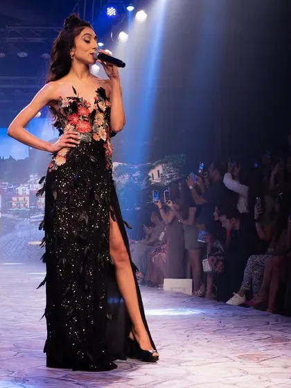 Another powerful shot from the Lakmé Fashion Week performance, with the audience and photographers capturing the moment.
