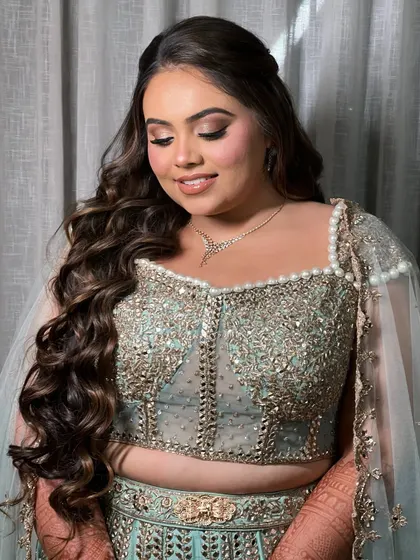 A soft, candid moment. This hairstyle is designed to be both beautiful and comfortable for a long event.