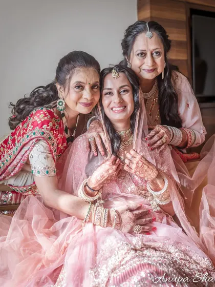 A formal portrait of the bride with her mother and mother-in-law. A cherished memory of three strong and beautiful women.