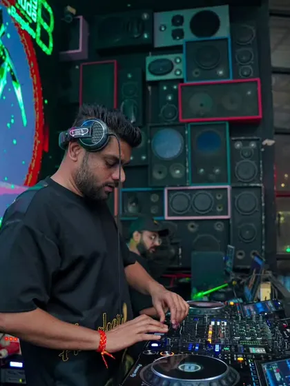 Focused on the mix, with abstract visuals from my VDJ set creating an immersive backdrop. The combination of audio and visuals is key to my club performances.