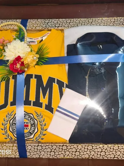 Gifting branded casual wear is very popular. Here, I've packed a Tommy Hilfiger t-shirt and a shirt, decorated with a simple floral bunch.