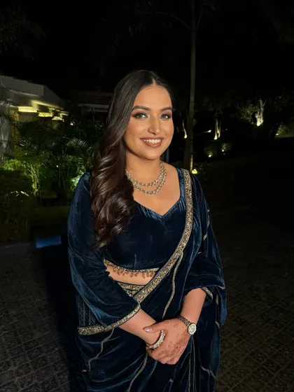 A goddess in midnight blue. For this evening look, I created a bronze smokey eye and glowing skin that perfectly complemented her velvet saree.