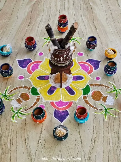 For the Sankranti festival, I painted a collection of terracotta pots and arranged them around a colorful rangoli. It was a fun way to celebrate the harvest festival with art.