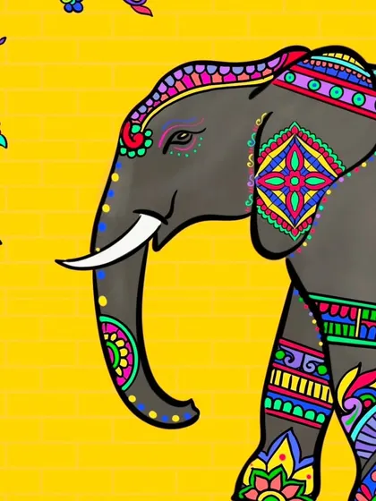 A close-up of the elephant's head and trunk, focusing on the intricate designs on its ear and headgear.