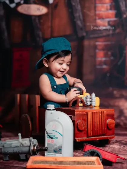 The garage has never seen this much charm. This little mechanic is ready to get to work.