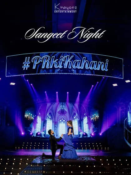 Your Sangeet night deserves a stage that matches its energy. We designed this dramatic, cathedral-inspired backdrop with dynamic lighting to create a truly cinematic experience for the couple's grand performance.