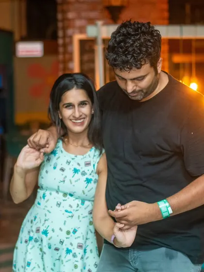 A cute and happy moment at the end of a dance. The connection lasts even after the music stops.
