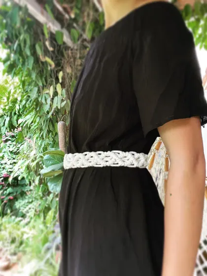 This is my other macrame belt design, featuring a wider, more intricate pattern. It's a statement piece that can be paired with dresses, jumpsuits, or even high-waisted shorts.