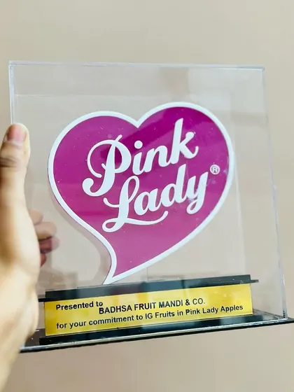 Beyond hampers, I can also source and create branded awards and merchandise. This is a custom 'Pink Lady' acrylic award I arranged for a corporate partner.