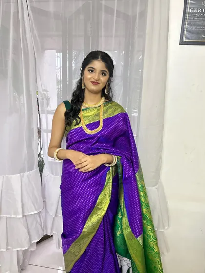 The full look of the bridesmaid in her traditional attire. She looks absolutely gorgeous.