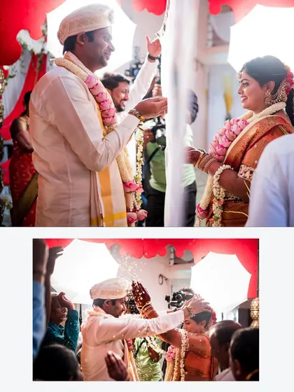 The 'Akshata' ritual, capturing the moment the couple blesses each other. The lighting and composition highlight the sacredness and joy of this tradition.