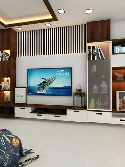 This TV unit combines open and closed storage, with a glass cabinet for displaying decor. The mix of wood and white laminate, along with the vertical slat paneling, creates a modern and balanced look.