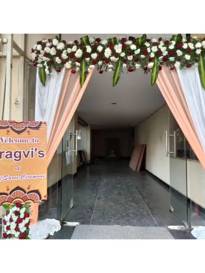 The entrance decor for a traditional Half-Saree ceremony.