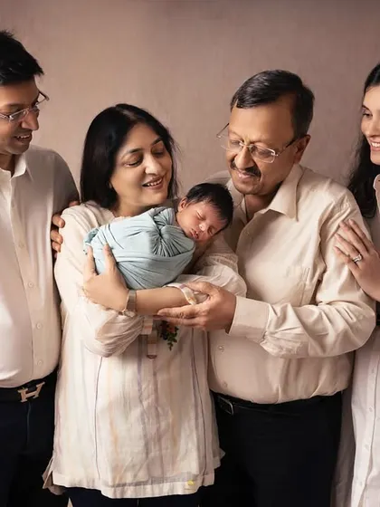 The whole family gathered to admire the tiny new addition. I love capturing these gentle, adoring gazes that show the deep love surrounding a newborn.