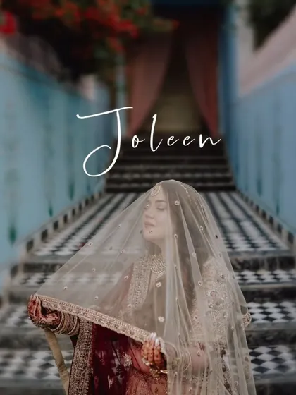 A beautiful, artistic shot of the bride under her veil, the checkered floor and staircase creating a unique and visually interesting composition.