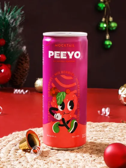 This festive shot for a mocktail brand uses Christmas themed props to create a celebratory mood. The vibrant colors of the can and the festive styling make it the perfect visual for a holiday marketing campaign.