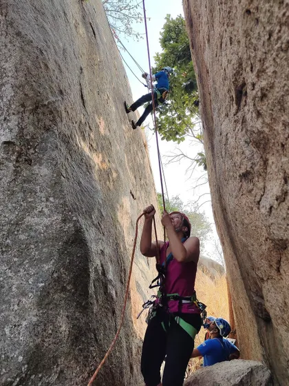 A climber practices her rappelling technique under the watchful eye of our instructors. Repetition and hands on practice are key to mastering these skills.