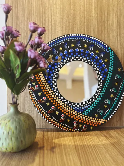 This stunning spiral dot mandala mirror was handcrafted in one of my workshops. It's a perfect example of how you can create a beautiful and functional piece of home decor, even as a beginner.