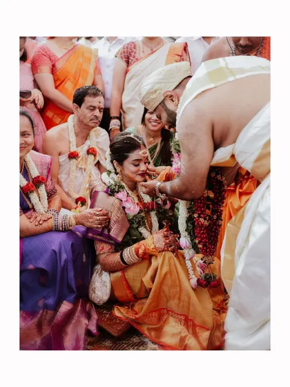 A high-angle shot of a tender moment between the bride and groom during the ceremony.