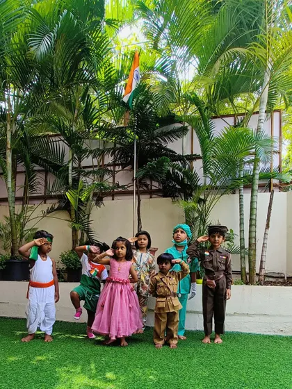 Saluting the flag with pride. We teach our children the importance of Independence Day and what the tricolor represents through simple, engaging activities.