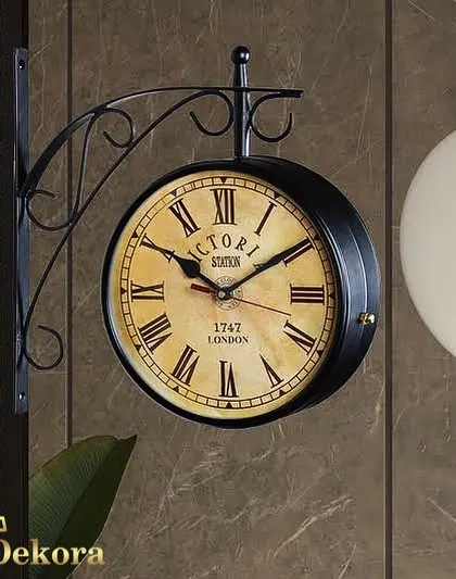 Our black station clock is shown here in a contemporary setting, proving its versatility as a decorative wall piece.