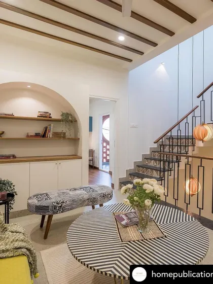 This view highlights the arched library nook and its connection to the staircase, showing how we create functional and beautiful features in every corner.