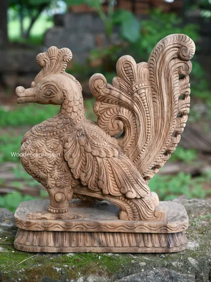 A 19-inch standing Hamsa (Annapakshi) sculpture with a natural wood color finish, perfect for bringing a touch of mythology to your decor.