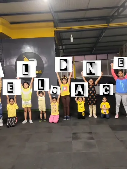 Our students proudly holding up letters to spell "Hello Dance." This fun activity is a great way to build studio pride and teamwork.