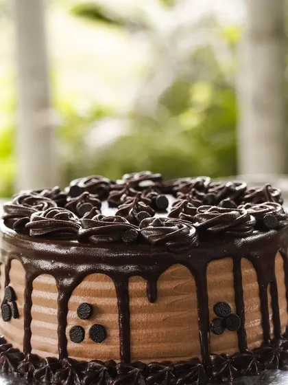 A celebration isn't complete without a stunning cake. This rich chocolate drip cake, decorated with chocolate chips and delicate piping, was the centerpiece of a beautiful brunch. It shows how my healthy bakes can be the star of any special occasion.