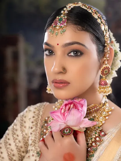 A powerful and poised bridal portrait. The makeup is designed to be camera-ready, ensuring you look stunning in every photograph.