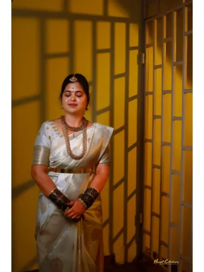 A serene bridal portrait using shadows from a window to create a unique and artistic pattern of light.