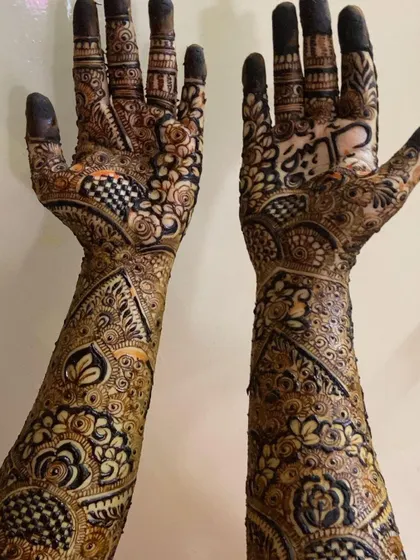 This is a detailed view of my intricate bridal henna work. Each design is unique, combining traditional patterns like paisleys and mandalas with fine-line fillers to create a stunning, full-coverage look for your special day.