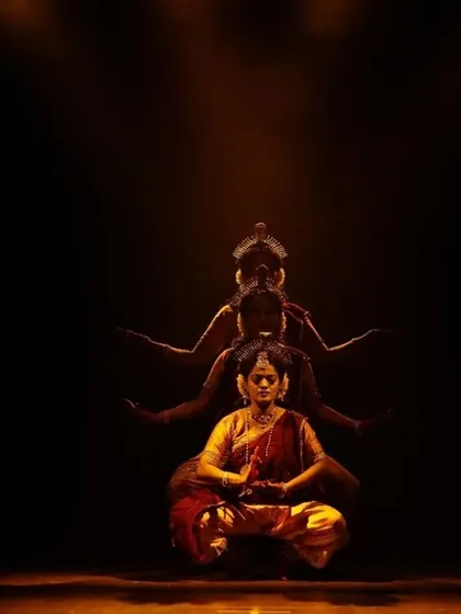 This artistic portrayal is from 'Shrishti Stithi Laya', a production that explores the cosmic cycles of creation, sustenance, and dissolution. The use of shadow and light highlights the intricate postures and meditative grace inherent in our storytelling, making it a profound addition to any cultural or corporate event.