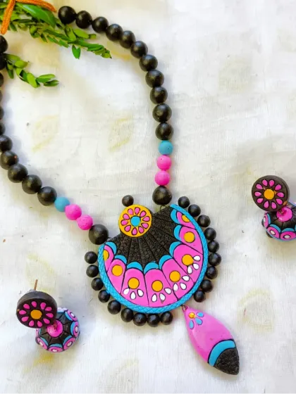 A pink and blue version of the fan-design necklace.