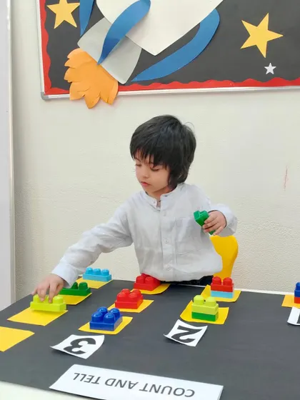 Building math foundations one block at a time. This activity helps children visualize numbers, making the abstract concept of counting tangible and understandable.