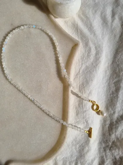 This is my 'vitika' Rainbow Moonstone ball toggle necklace. It's a beautiful piece for bringing balance, harmony, and hope into your life.