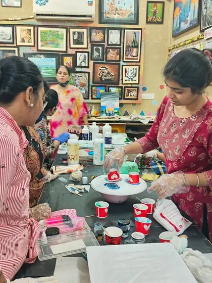 A resin art workshop in full swing, with students preparing their cups for a pour. The atmosphere in our classes is always buzzing with creative energy.