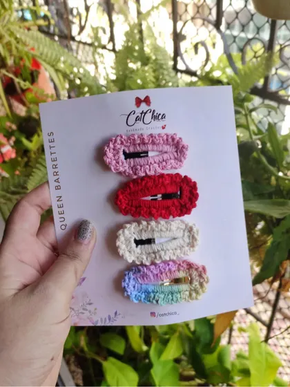 The "Queen Barrettes" set, perfect for a classic look with pink, red, cream, and rainbow clips.