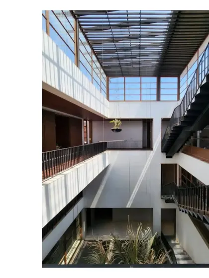 The interior courtyard of our Ishtika project, showing the play of light and shadow through the slatted roof. The name means 'brick' in Sanskrit, and the home is a celebration of this humble, powerful material.