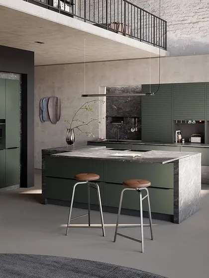 A bold kitchen design in a deep green, paired with a textured concrete-look island. This shows how we can play with color and texture to create a unique statement.