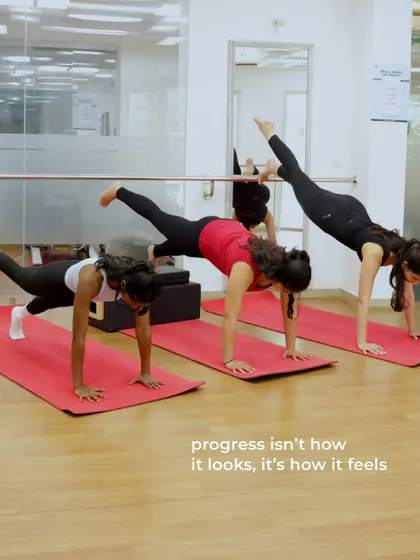Three women show different levels of a plank with leg lift, embodying our philosophy that progress is personal and unique to each journey.