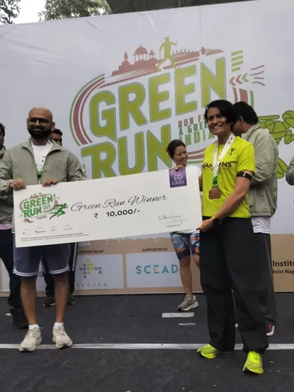 Receiving the prize check for the Green Run. This is the result of consistent training and a refusal to give up, even on tough days.