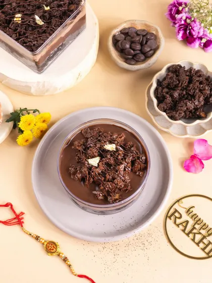 This Rakhi-themed shot includes a "Happy Rakhi" tag and a traditional rakhi to connect the modern dessert with the festival.
