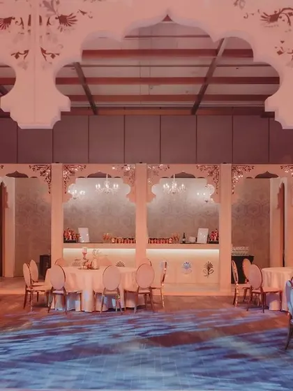 The walk-in bar was designed to be both functional and a statement piece, with intricate detailing on the facade and elegant chandeliers overhead.